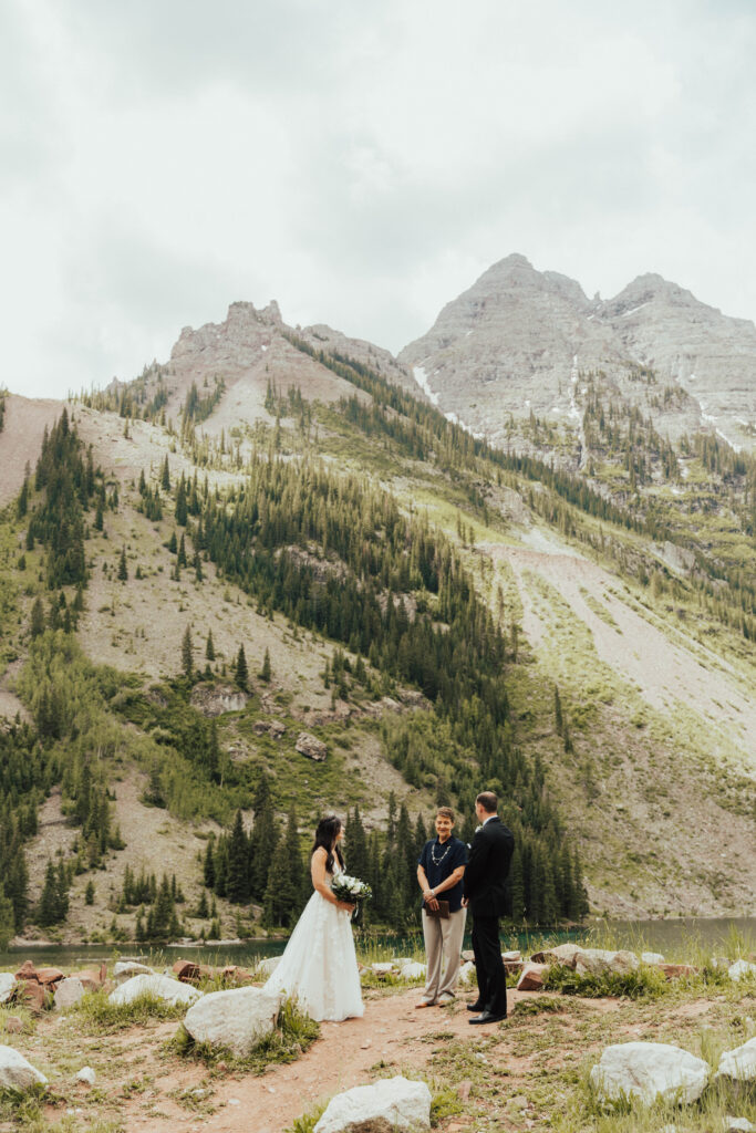 maroon bells wedding photos, maroon bells elopement, mountain elopement inspiration, aspen wedding, wedding ceremony photos, mountain wedding inspiration, elopement inspiration, colorado wedding, wedding photographer, aspen wedding photographer, aspen wedding photos, aspen wedding photos, maroon bells elopement photos, maroon bells amphitheater wedding photos, bride and groom photos, wedding dress inspo, destination wedding photographer, elopement photographer