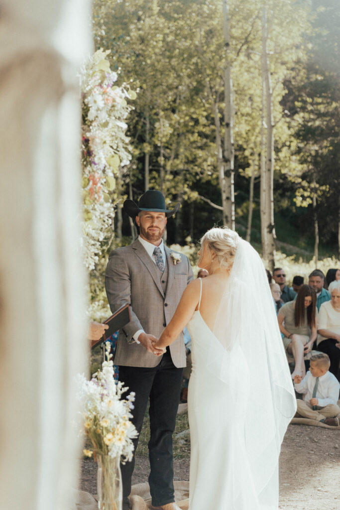 luxury mountain wedding photographer, intimate wedding venue, colorful wedding, wildflower wedding floral arrangements, western luxe groom inspiration, destination wedding photographer, timeless mountain wedding photos, couture wedding gown inspiration, elegant outdoor wedding ceremony, intimate mountain wedding ceremony