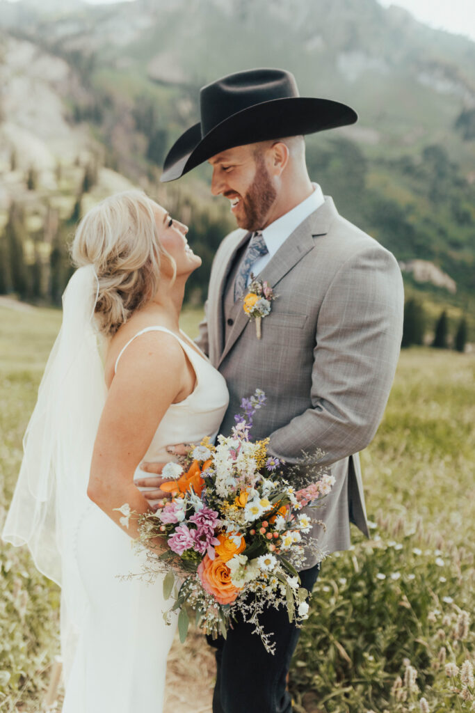 luxury mountain wedding photographer, intimate wedding venue, colorful wedding, wildflower wedding floral arrangements, western luxe groom inspiration, destination wedding photographer, timeless mountain wedding photos, couture wedding gown inspiration, elegant outdoor wedding ceremony, intimate mountain wedding ceremony, alta lodge wedding photos