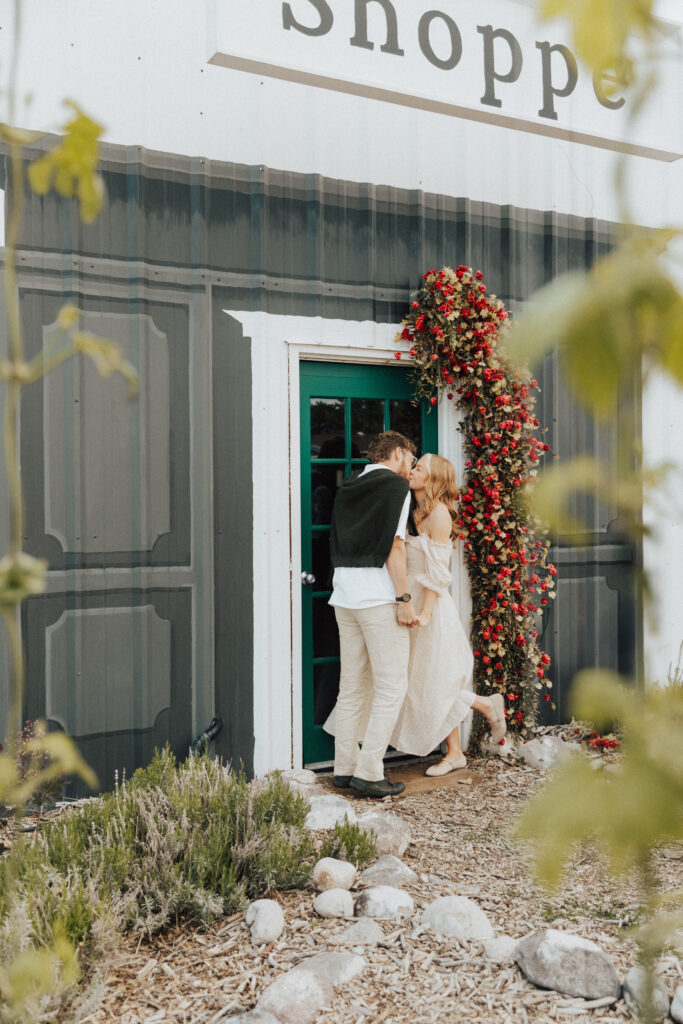 paris engagement session style photo with couple framed by ivy and cottage architecture