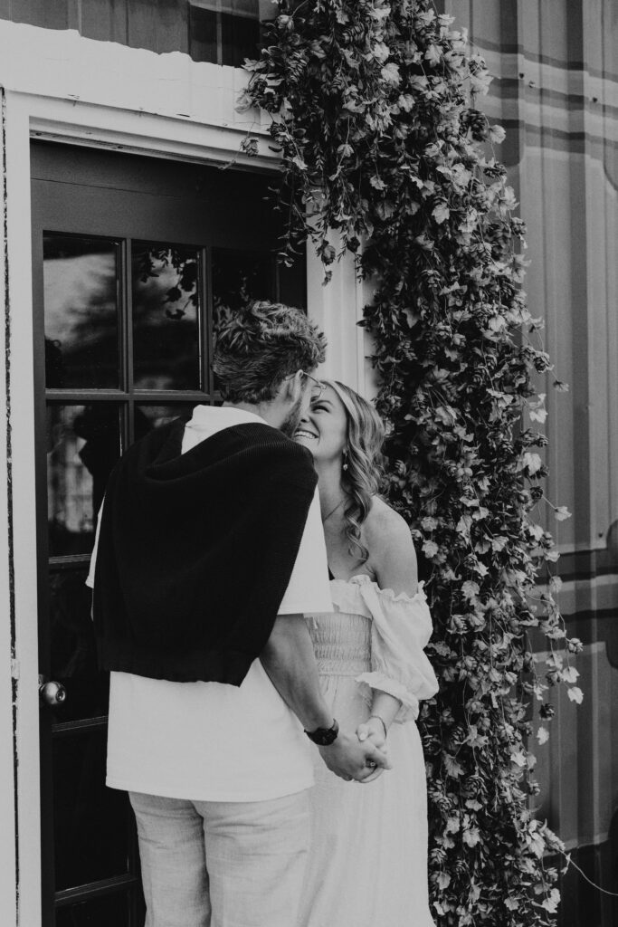 destination engagement photographer capturing european café aesthetic with greenery backdrop
