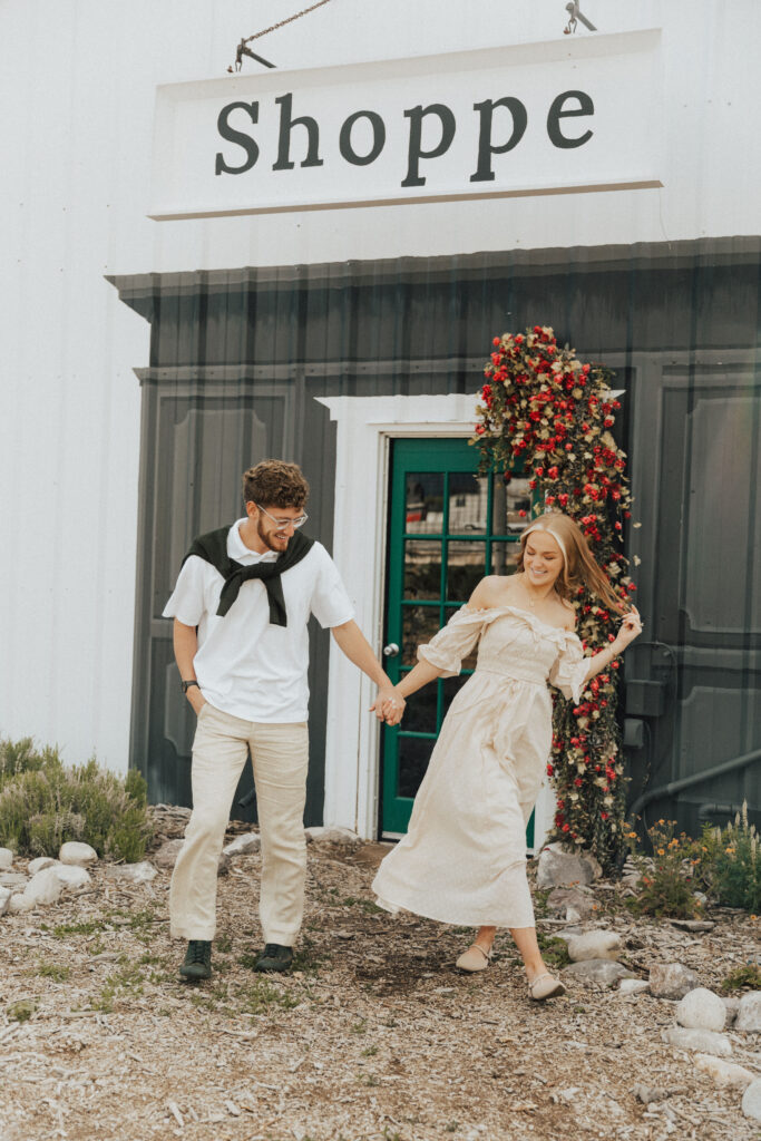 couple walking hand-in-hand in a european café setting inspired by paris engagement sessions
