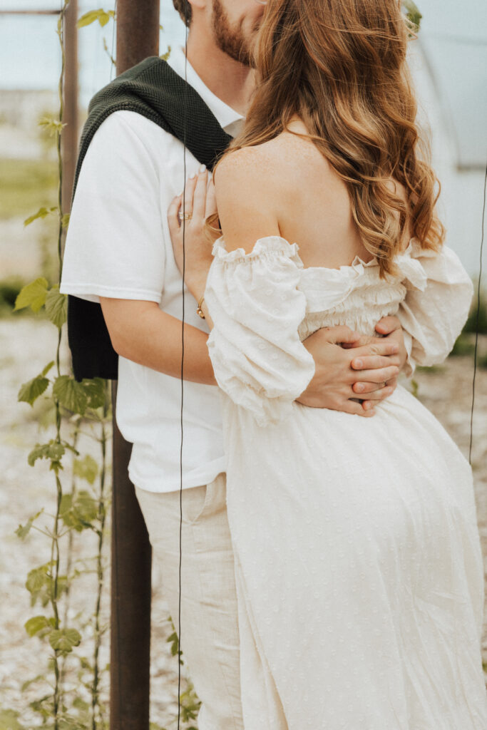 provence inspired engagement image featuring neutral outfits and airy european atmosphere