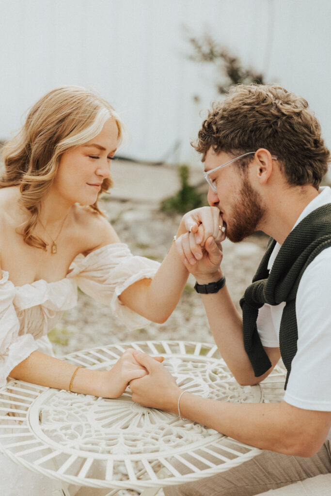 french café couple photos with relaxed, candid posing and soft natural lighting