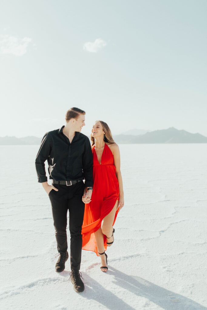 Red dress swirling during movement prompts at destination Salt Flats engagements.