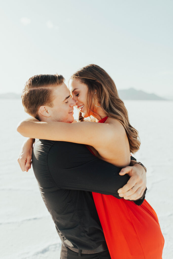 Close-up of couple against the white Salt Flats landscape.