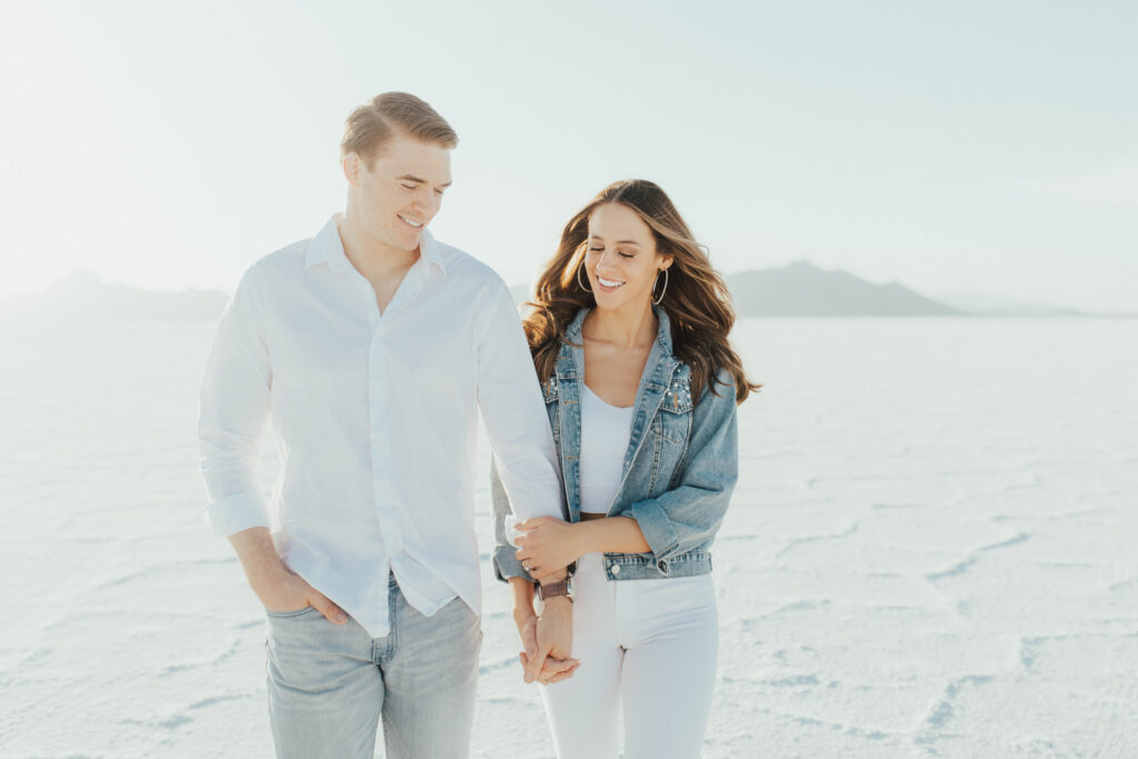Bride wearing custom denim jacket during golden hour Salt Flats engagements.