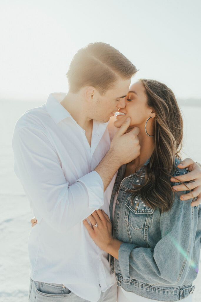 Close-up portraits while groom is about to kiss bride during Salt Flats engagements