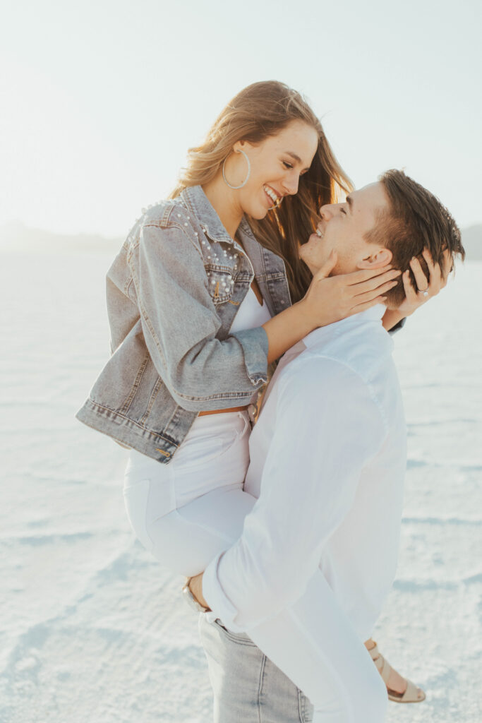 Bride smiling toward groom during destination Salt Flats engagements.