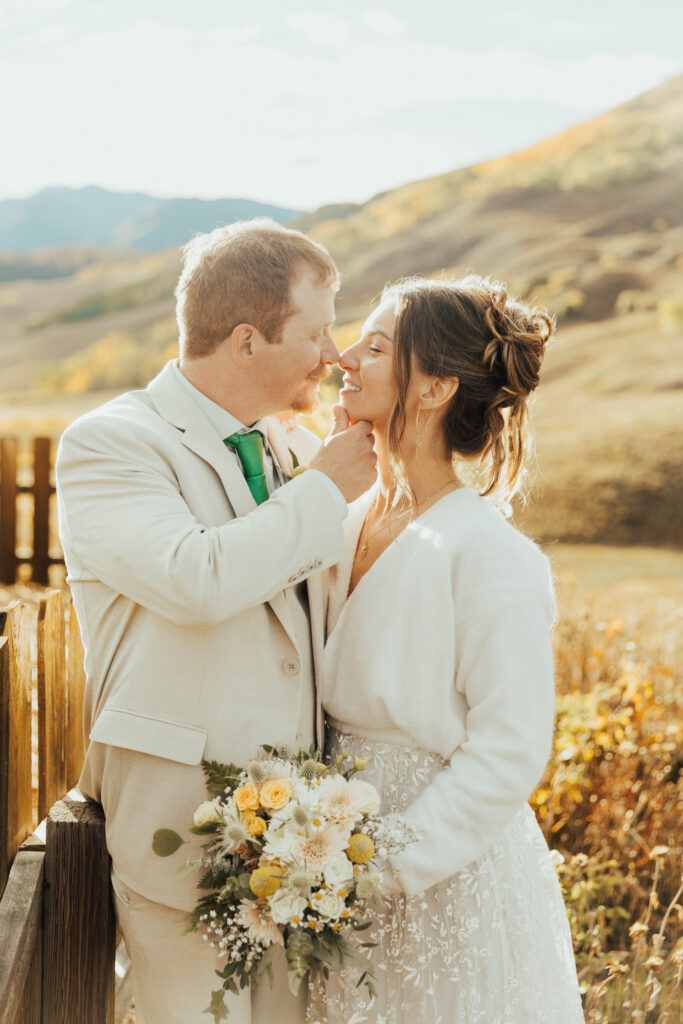 Crested Butte wedding photographer capturing a fall ceremony at Mountain Wedding Garden surrounded by golden aspens.